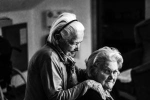 Elderly woman with adult child